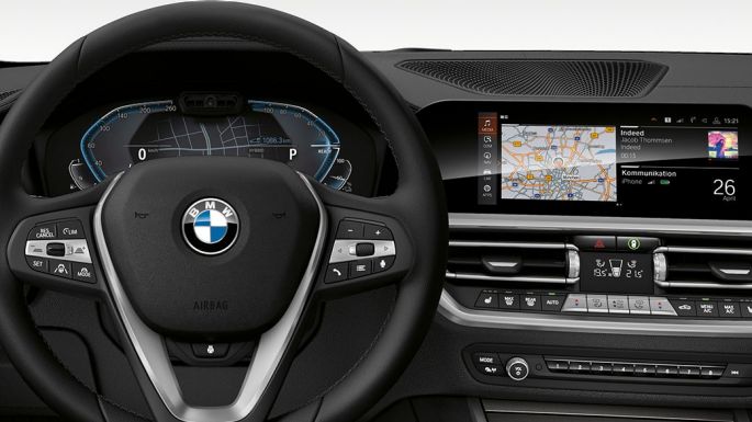 BMW 3 Series Sedan, Cockpit. Detailed frontal view of the BMW 3 Series Sedan cockpit with i-specific display.