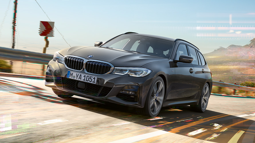 BMW Серия 3 Туринг (G21) Dravite Grey, три четвърти снимка отпред BMW Серия 3 Туринг (G21) Dravite Grey, три четвърти снимка отпред при шофиране сред природата