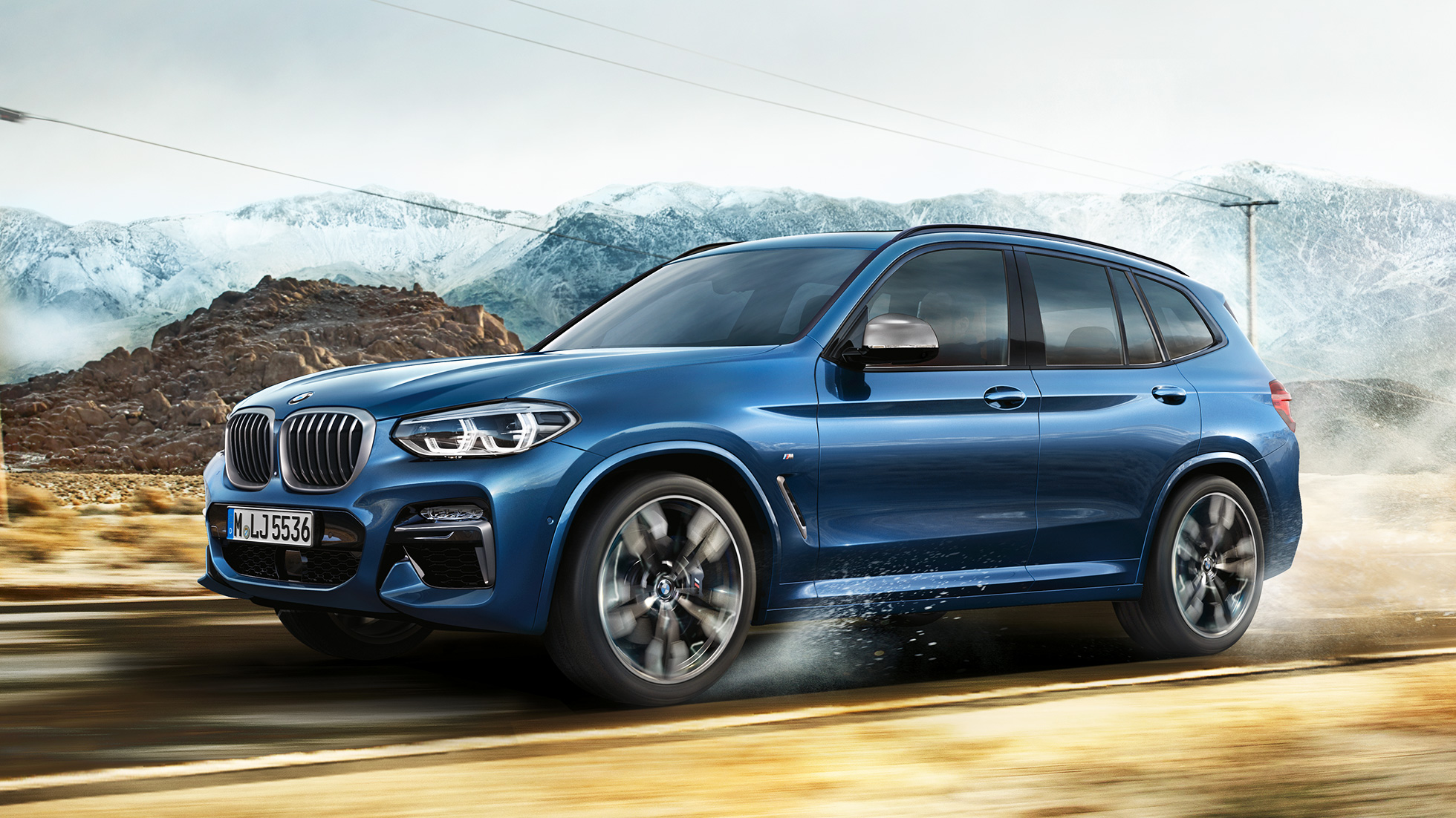 BMW X3 M40i, полупрофил на джанта и калник на фона на планините BMW X3 M40i, полупрофил на джанта и калник на фона на планините
