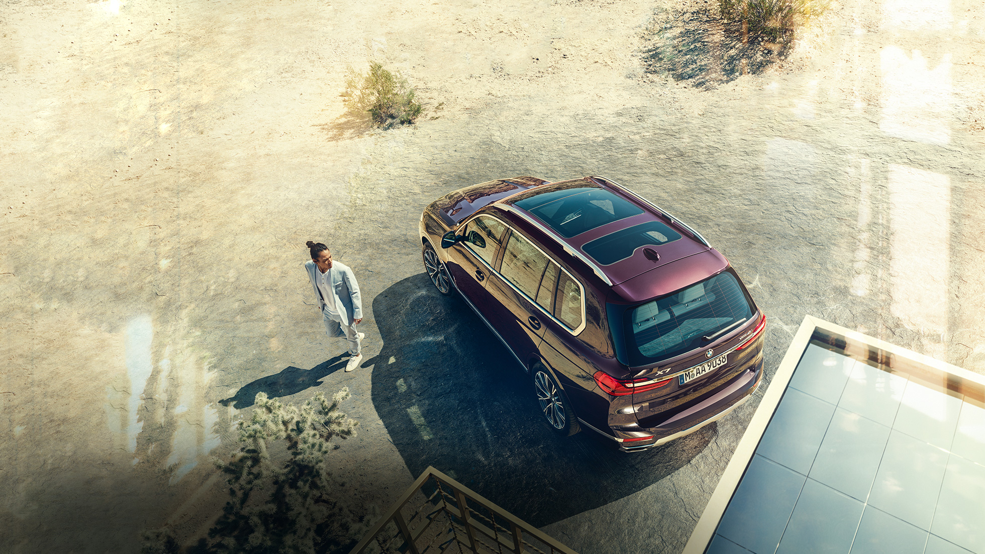 BMW Individual X7 40i xDrive, три четвърти изглед отпред BMW X7 в Ametrin Metallic в движение, три четвърти изглед отпред